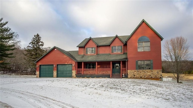 view of front of house featuring covered porch and a garage