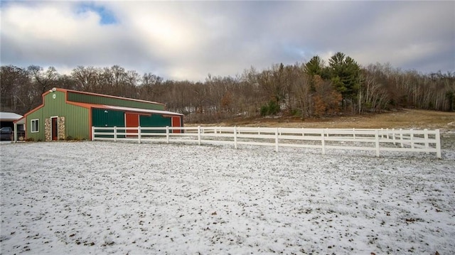 view of home's community with a rural view and an outdoor structure