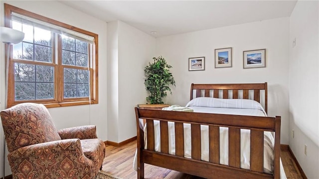 bedroom with hardwood / wood-style floors