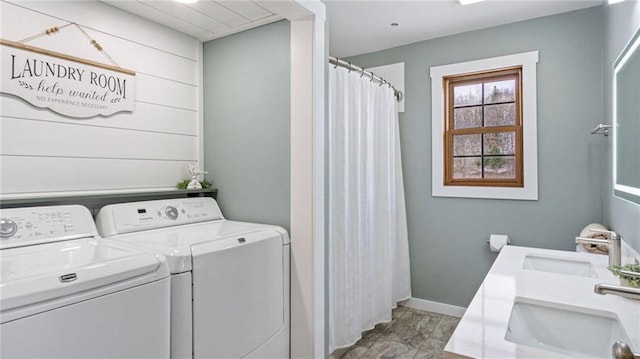 laundry area with washer and clothes dryer and sink