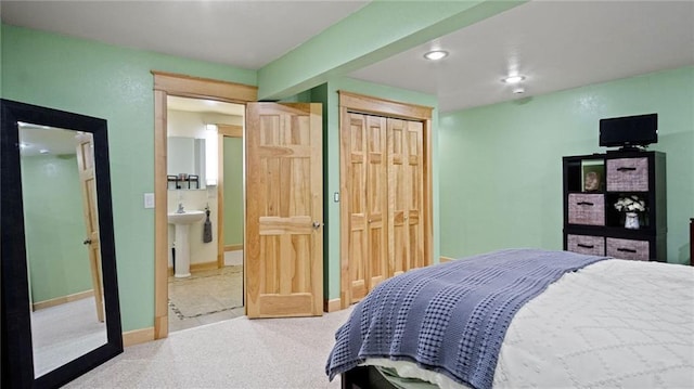 bedroom featuring carpet flooring and ensuite bathroom