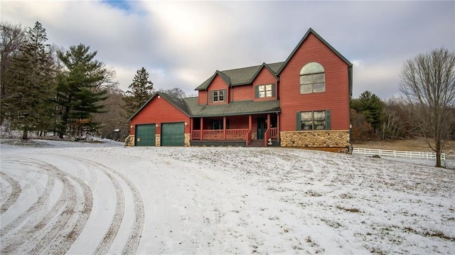 view of front of property featuring a porch and a garage