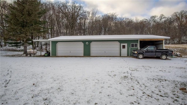 view of snow covered garage