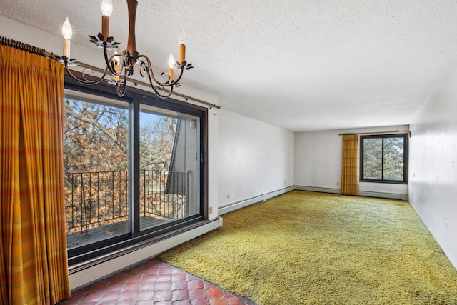 carpeted spare room with a chandelier, baseboard heating, and a textured ceiling