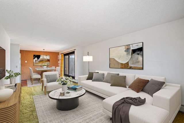 living room with a notable chandelier and a textured ceiling