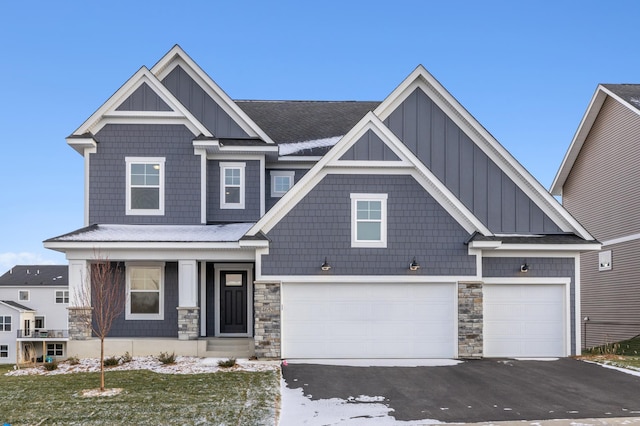 craftsman-style home featuring a garage and covered porch