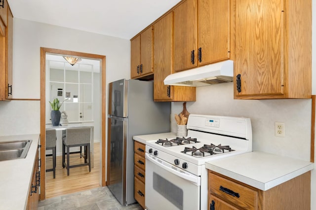 kitchen with sink and white gas range oven