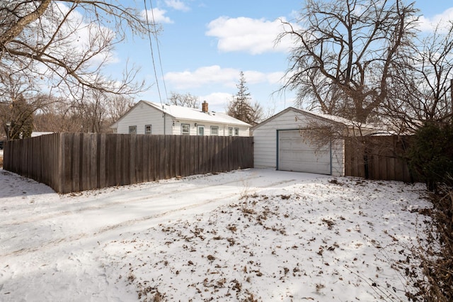 view of snow covered garage