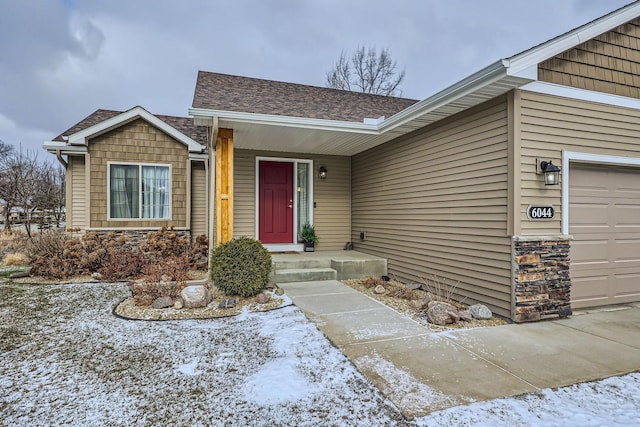 entrance to property featuring a garage