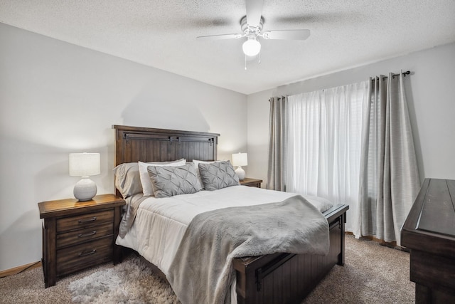 bedroom with carpet flooring, ceiling fan, and a textured ceiling