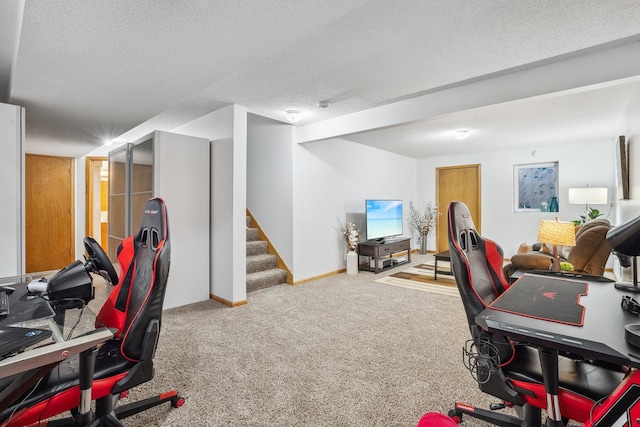 home office with carpet and a textured ceiling