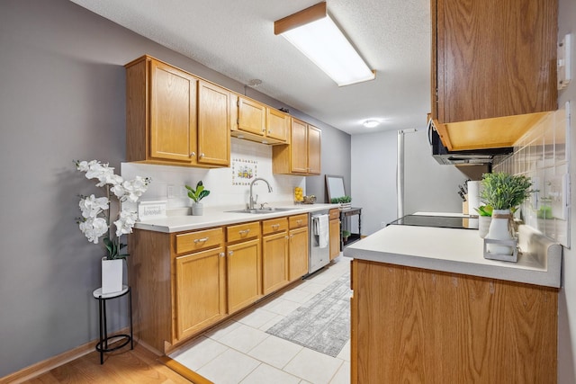 kitchen featuring decorative backsplash, stainless steel dishwasher, a textured ceiling, sink, and light tile patterned flooring