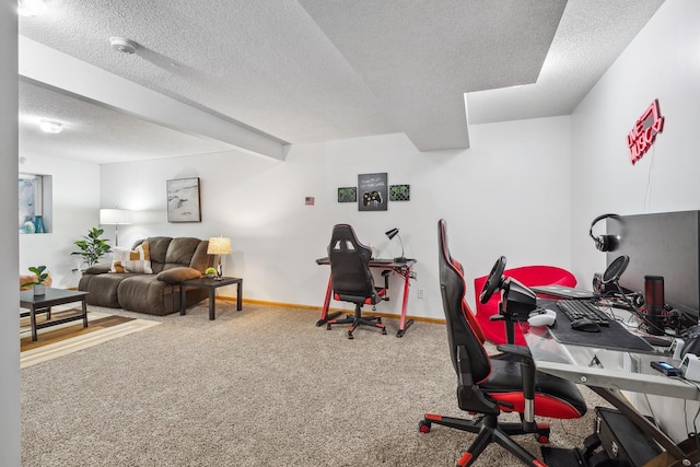 office area featuring carpet, beam ceiling, and a textured ceiling