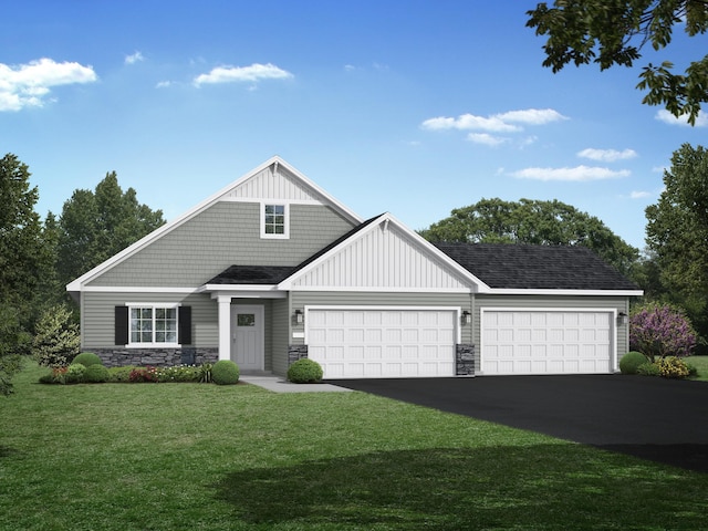 view of front of house featuring a front yard and a garage