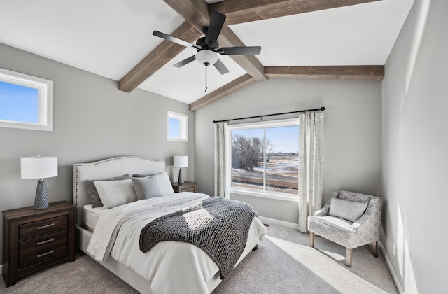 bedroom featuring vaulted ceiling with beams, ceiling fan, and light colored carpet