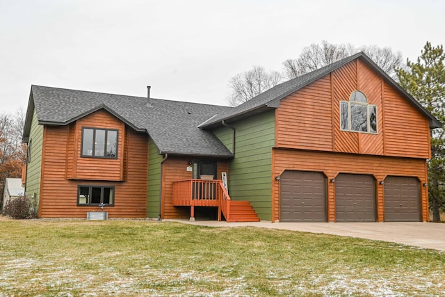 view of front of house with a front yard and a garage