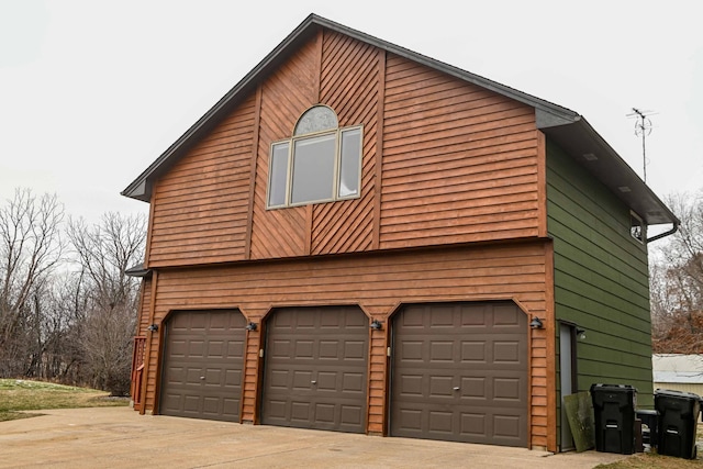 view of property exterior featuring a garage