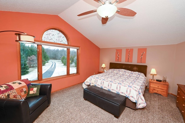 carpeted bedroom with vaulted ceiling and ceiling fan