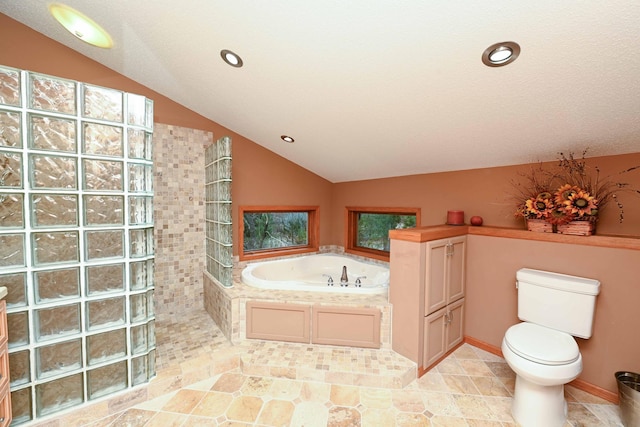 bathroom with toilet, a textured ceiling, separate shower and tub, and vaulted ceiling