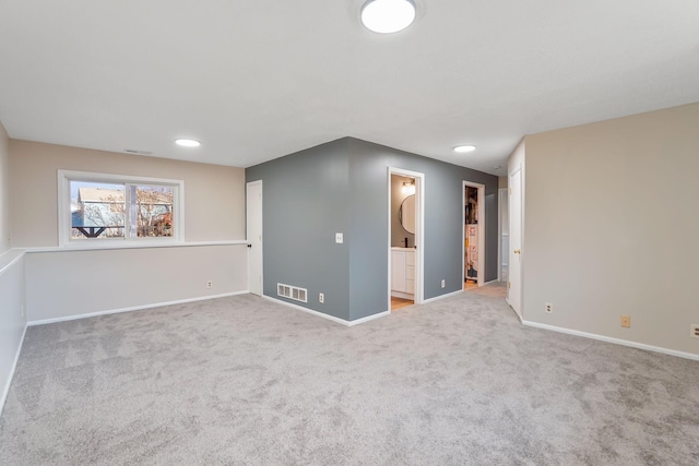 unfurnished room featuring carpet flooring