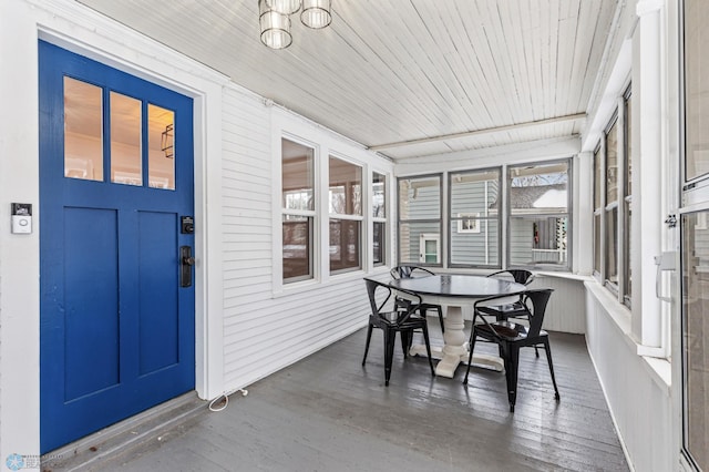 sunroom / solarium featuring wood ceiling