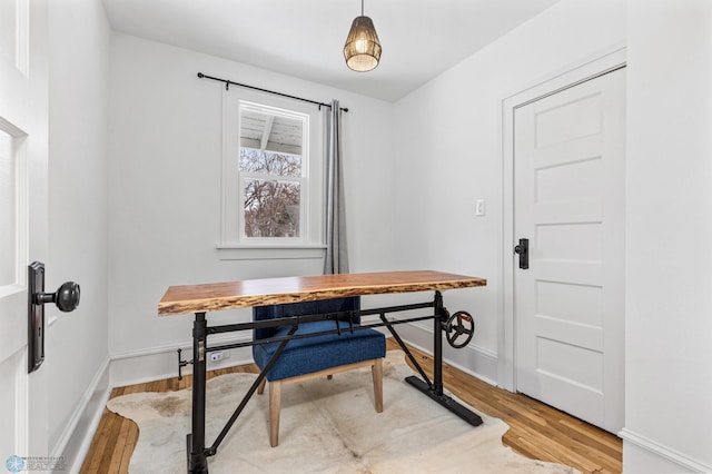 office space with light hardwood / wood-style floors