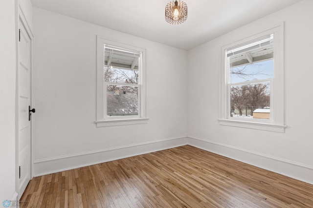 unfurnished room featuring wood-type flooring