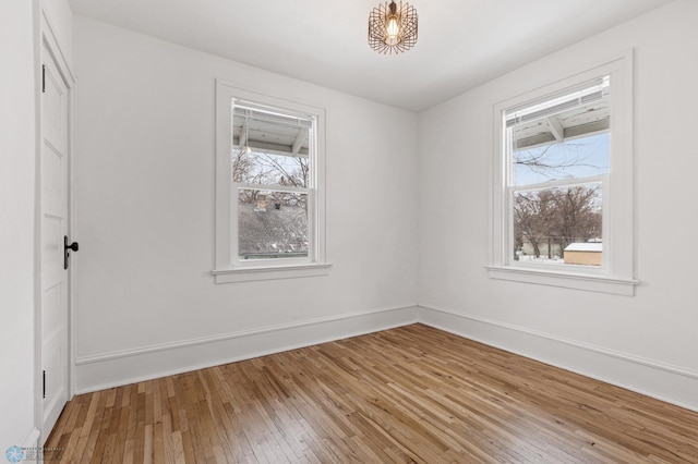 1018 11th St S, Fargo, ND 58103 - empty room featuring light wood-style floors and baseboards