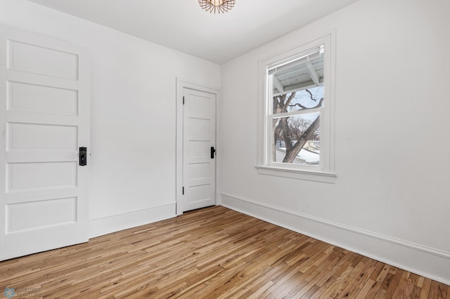 empty room with light hardwood / wood-style floors