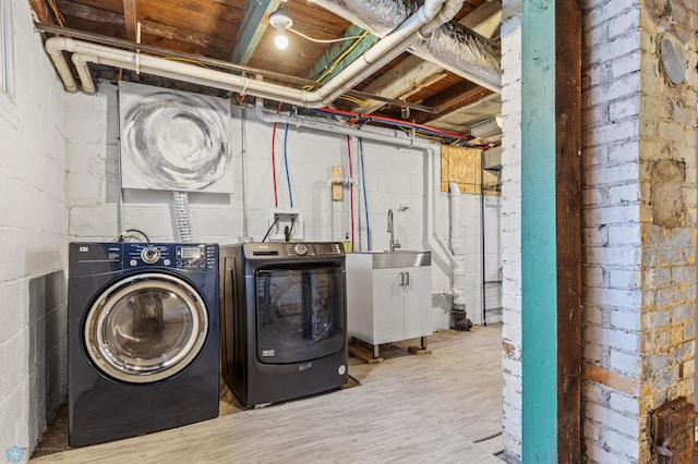 1018 11th St S, Fargo, ND 58103 - laundry room with separate washer and dryer and wood finished floors