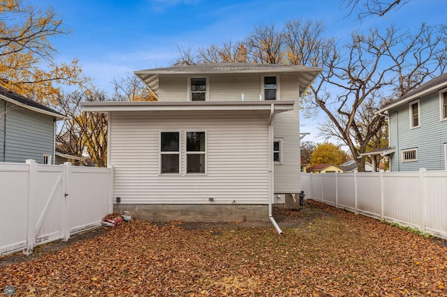 1018 11th St S, Fargo, ND 58103 - back of property featuring a fenced backyard and a gate