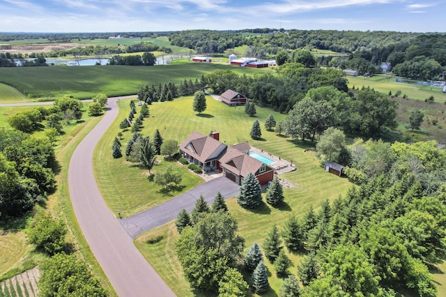 drone / aerial view featuring a water view and a rural view