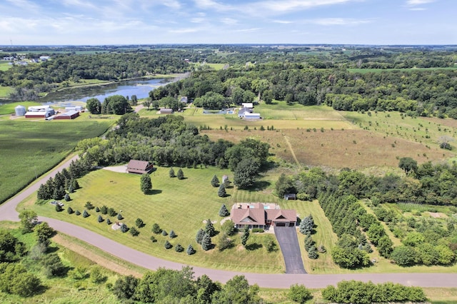 birds eye view of property with a rural view and a water view