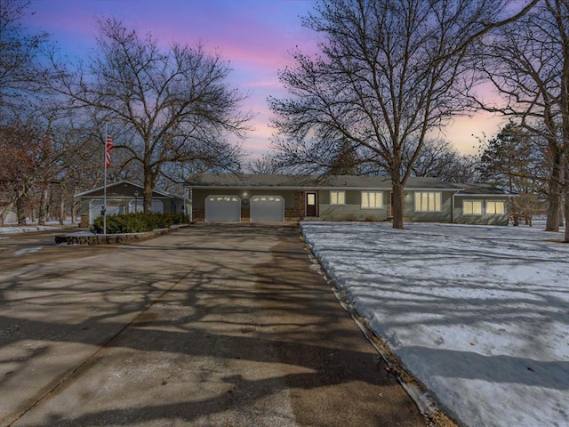 view of front of property with a garage and driveway