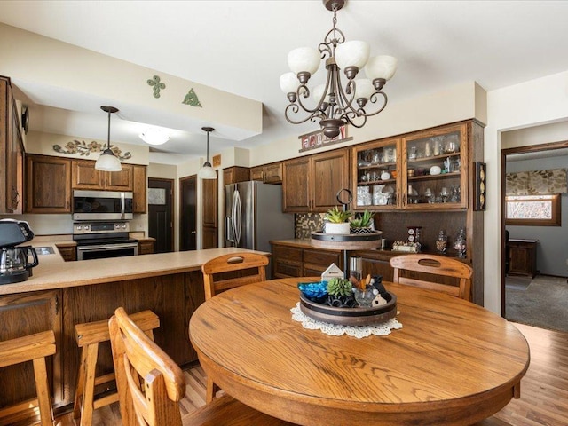 dining space featuring a notable chandelier