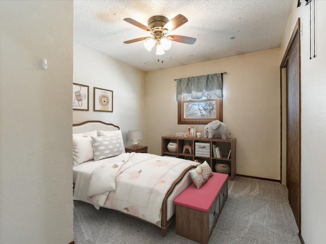 bedroom featuring a ceiling fan, carpet flooring, and a textured ceiling