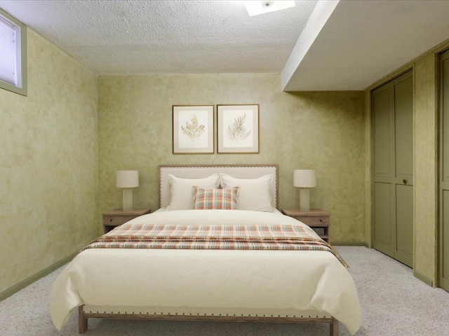 carpeted bedroom featuring a textured ceiling