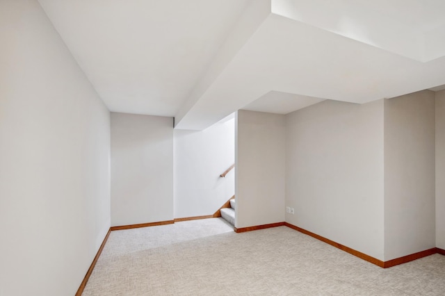 bonus room featuring stairway, baseboards, and carpet flooring