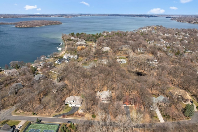 drone / aerial view featuring a water view and a residential view