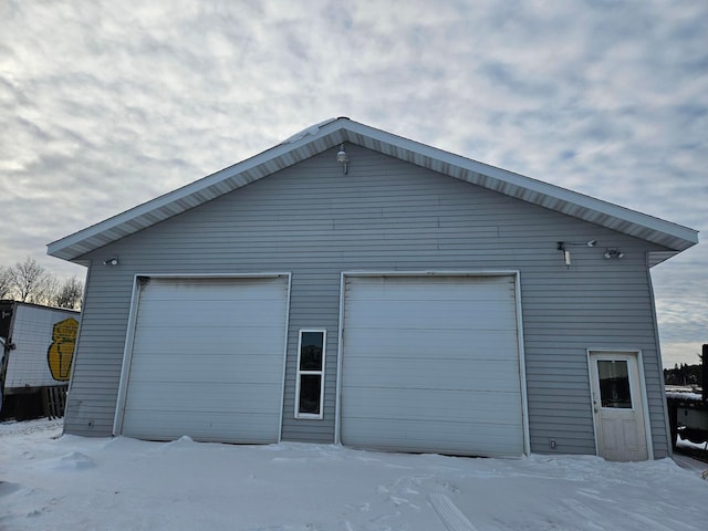 view of snow covered garage