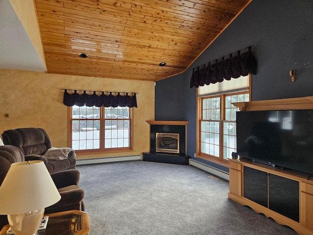 carpeted living room with plenty of natural light, baseboard heating, and vaulted ceiling