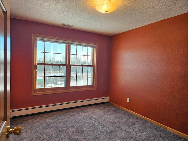 carpeted empty room featuring a textured ceiling and a baseboard radiator