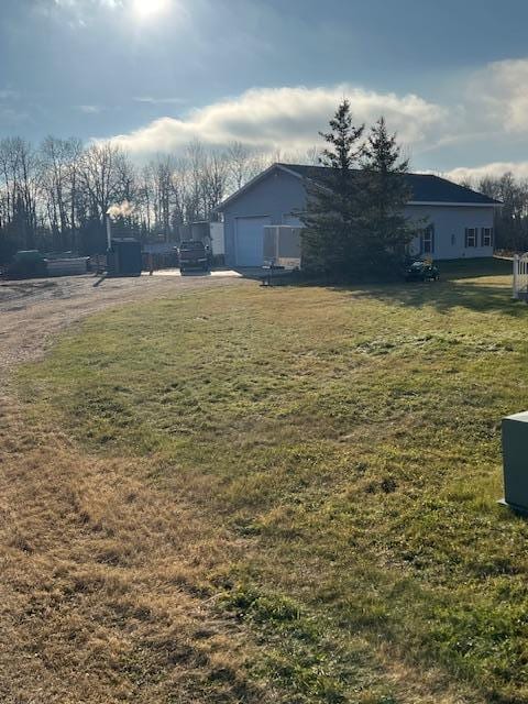 view of yard featuring a garage