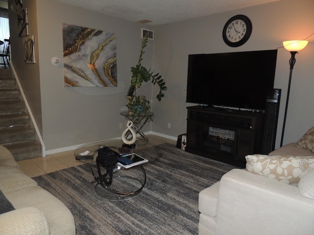 tiled living room with a textured ceiling