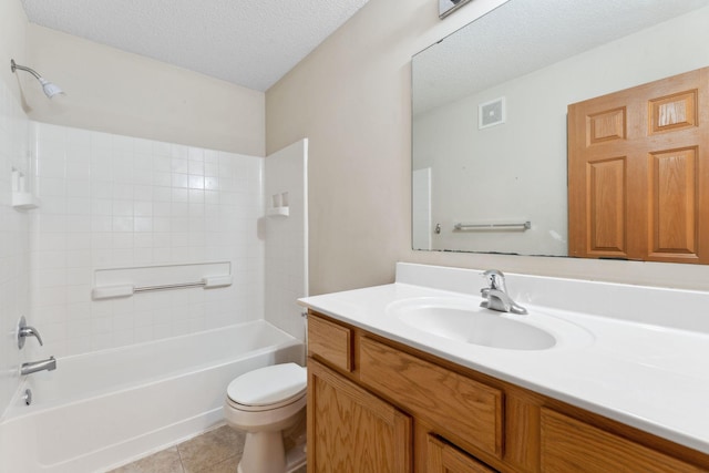 full bathroom with tile patterned floors, vanity, a textured ceiling, shower / bathing tub combination, and toilet