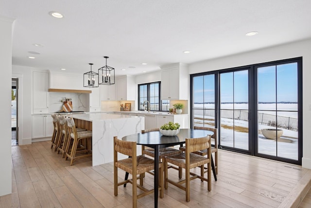 dining area with recessed lighting, visible vents, and light wood-style flooring