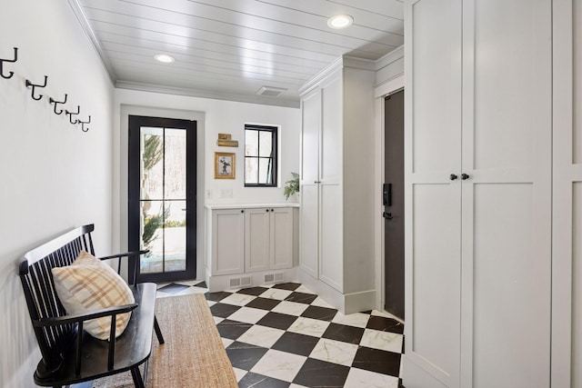 interior space with tile patterned floors, visible vents, ornamental molding, and recessed lighting