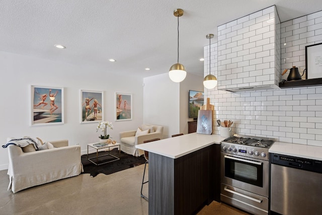 kitchen with tasteful backsplash, open floor plan, light countertops, appliances with stainless steel finishes, and a peninsula