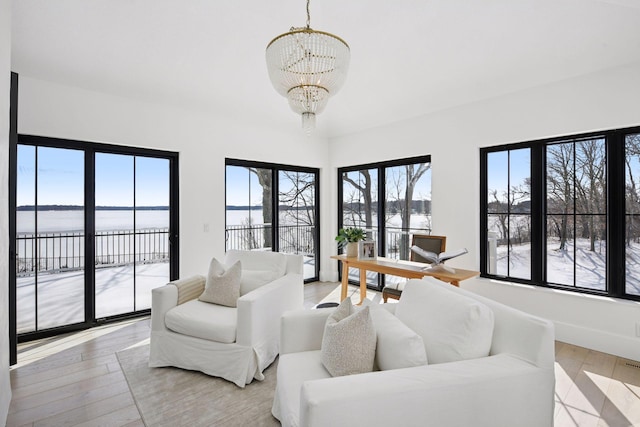2070 Shoreline Dr, Orono, MN 55391 - living area featuring a chandelier, light wood finished floors, and a water view