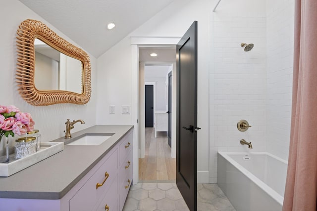 2070 Shoreline Dr, Orono, MN 55391 - bathroom with vaulted ceiling, vanity, shower / tub combo with curtain, recessed lighting, and tile patterned flooring